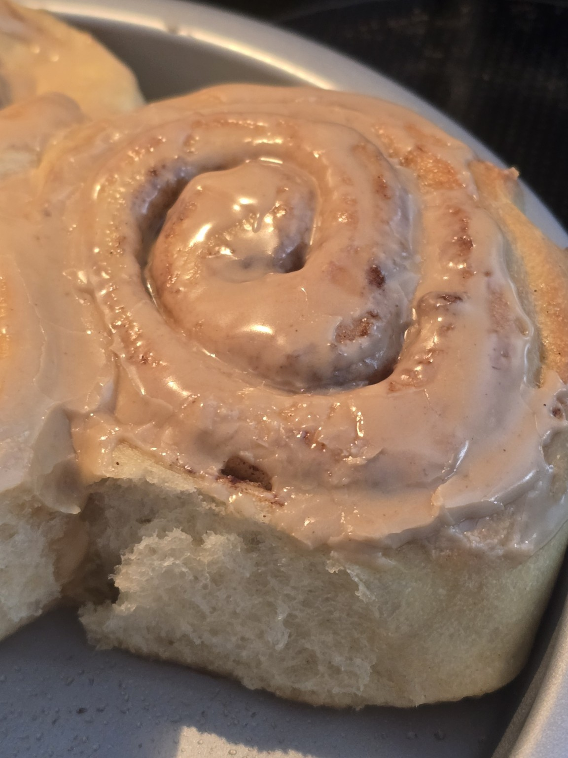 Cinnamon roll topped with rich espresso icing