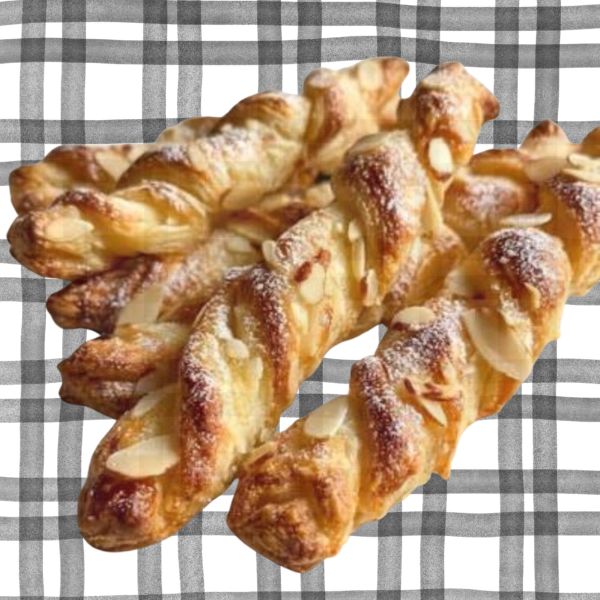 Golden sour cream almond twists topped with sliced almonds and powdered sugar